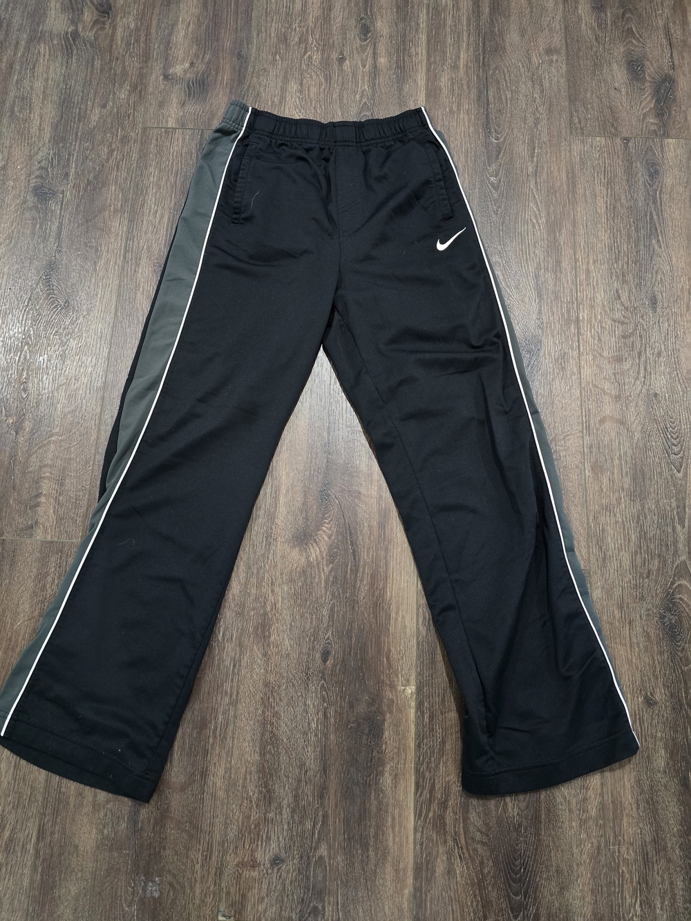 Nike Kids Black Joggers with White Piping and Gray Side Panels